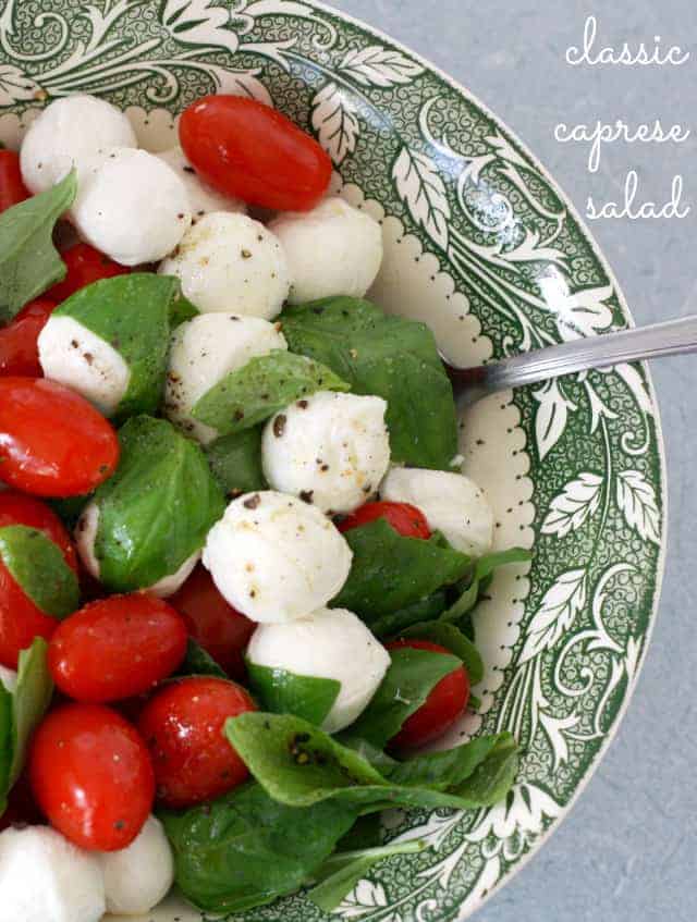 fresh caprese salad in a green and white bowl