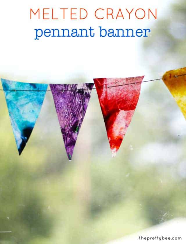A colorful project to hang in the window - a melted crayon and waxed paper pennant banner.