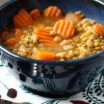 lentil soup in a blue bowl