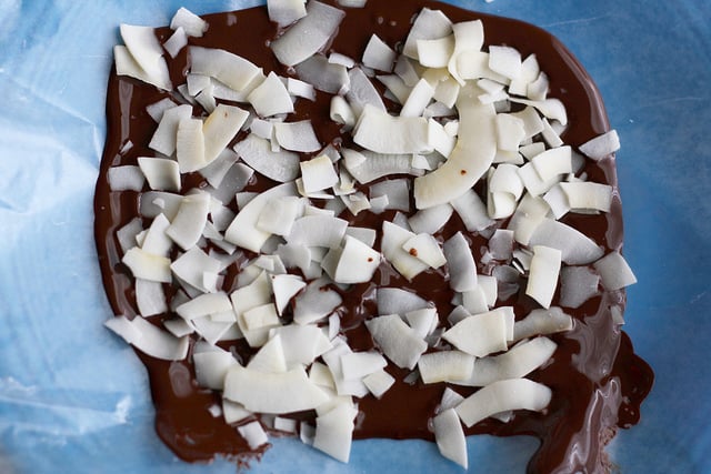 melted chocolate with coconut flakes on top