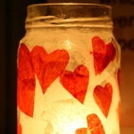 A super simple Valentine's Day craft - candle holders made from recycled jars and tissue paper hearts. #valentinesday