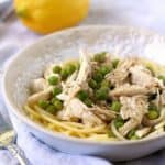 lemon chicken and pasta in a white bowl