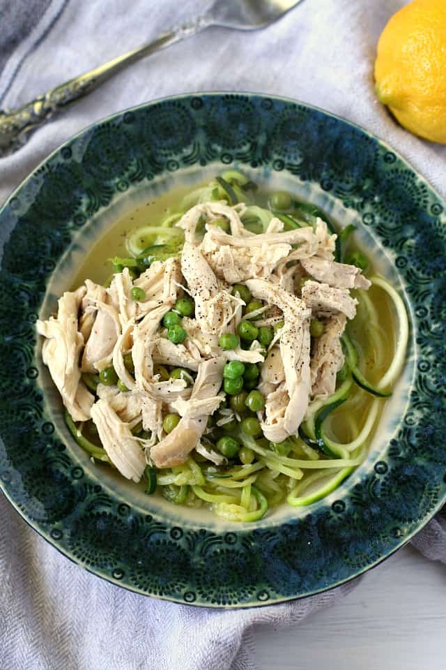 lemon chicken with zoodles in a blue dish