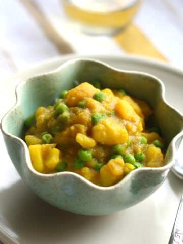 Potatoes and peas in a creamy, spicy, dairy free sauce. Easy vegan and gluten free comfort food.