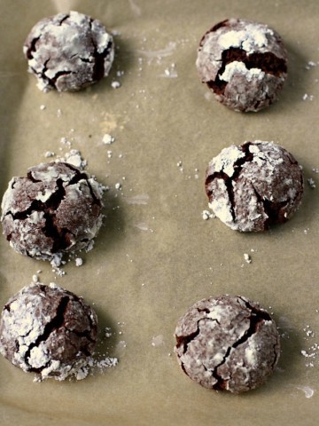 chocolate crinkles on a cookie sheet