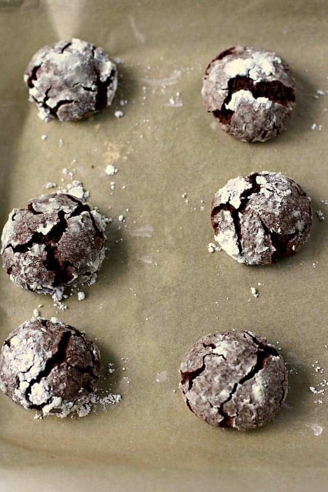 chocolate crinkles on a cookie sheet