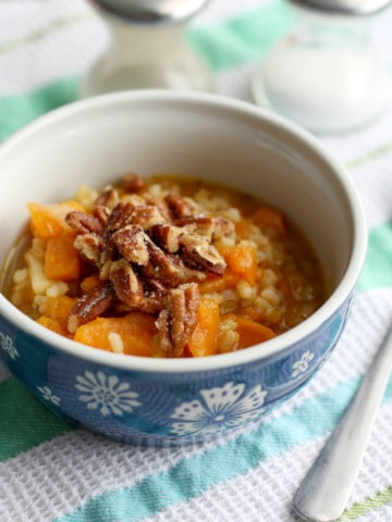 A hearty winter meal - sweet potato and brown rice soup topped with crunchy toasted pecans.