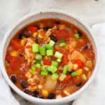 chicken and bean chili in a white bowl