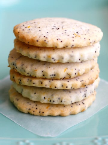 Buttery lemon poppy seed cookies are crisp and delicious! Make them special by adding a simple glaze. Vegan and gluten free cookie recipe, and free of the top 8 allergens.