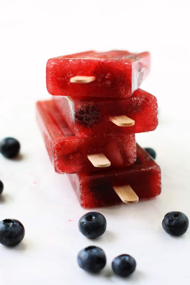 stack of popsicles with blueberries