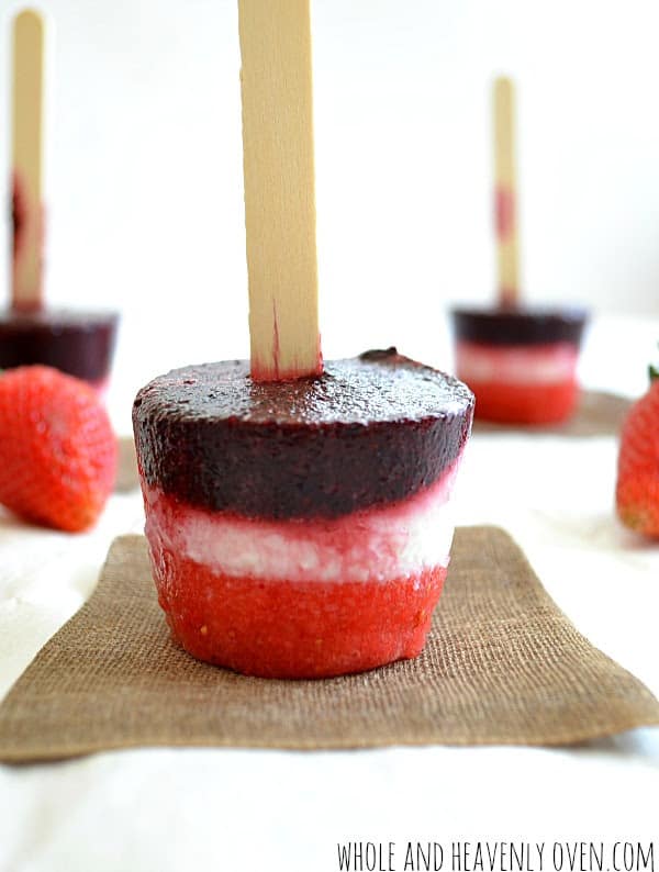Red, white, and blue popsicles made with berries and yogurt...perfect for July 4th!
