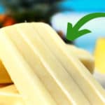 pina colada popsicles with pineapple in the background