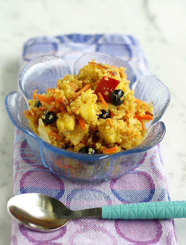 Fresh and healthy curried quinoa salad with fruit.