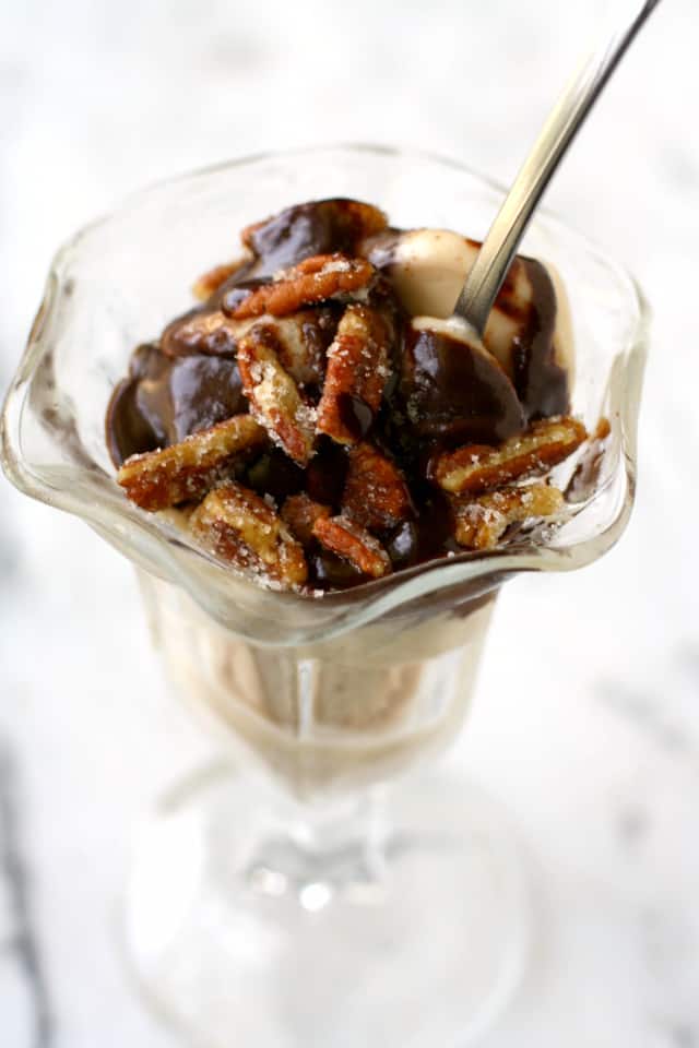 A decadent hot fudge sundae with coconut rum sauce and sugared pecans. A truly special treat!