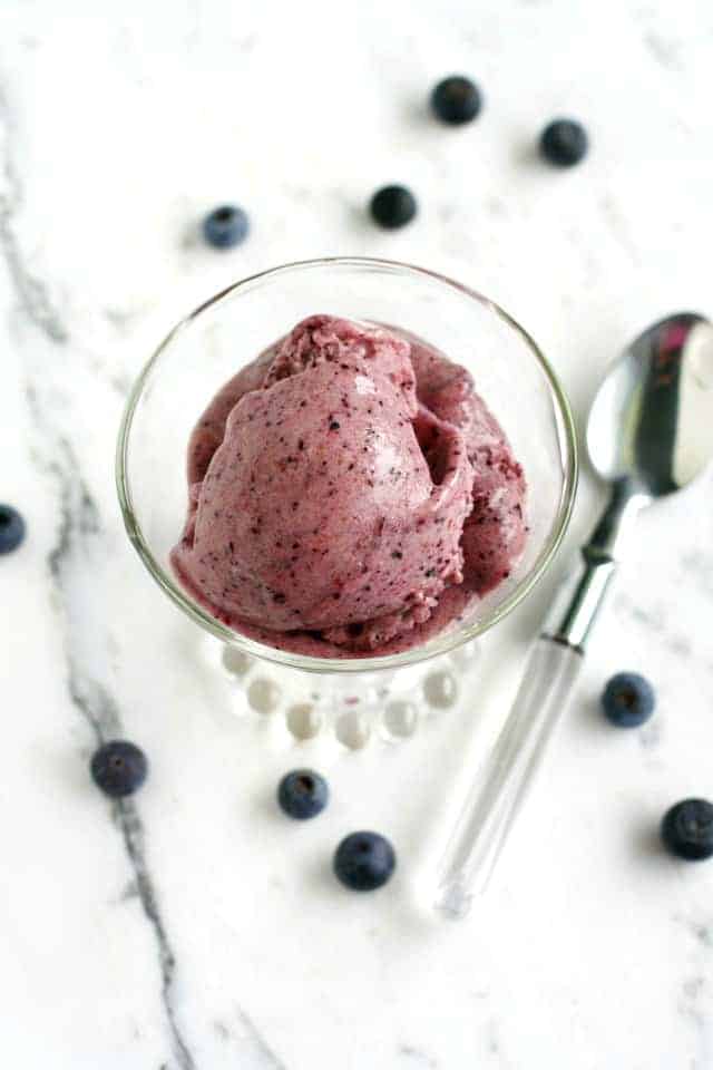 no churn blueberry ice cream in a clear dish
