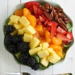 A rainbow salad filled with fresh fruit and topped with poppyseed dressing. Vegan and gluten free. #vegan #glutenfree