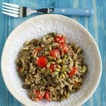 A tasty and healthy salad made with lentils, quinoa, tomatoes, and pepitas.