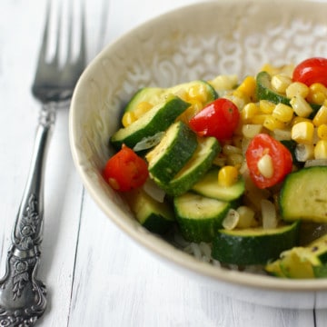 Summer in a bowl - zucchini, tomatoes, corn, and onions over rice.