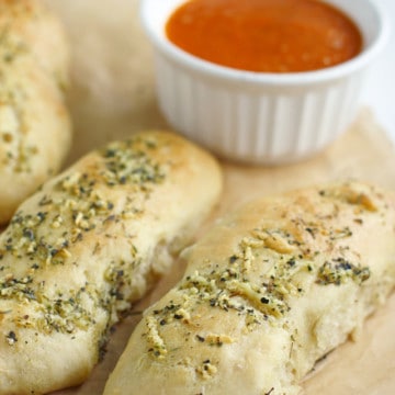 Easy to make homemade fluffy breadsticks with marinara sauce. These are delicious and kid friendly!