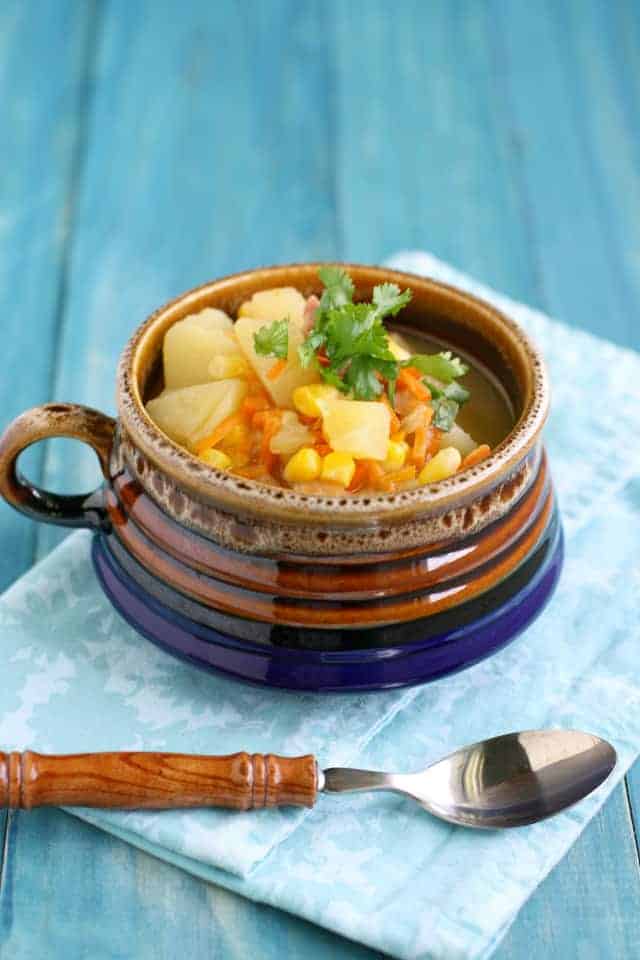 corn potato soup in a ceramic bowl
