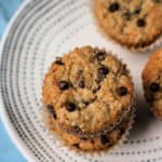 chocolate chip banana oat muffins on a white plate