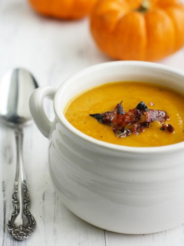 Creamy and comforting butternut squash soup made wtih apples and bacon. This soup is a delicious way to welcome the cooler weather!