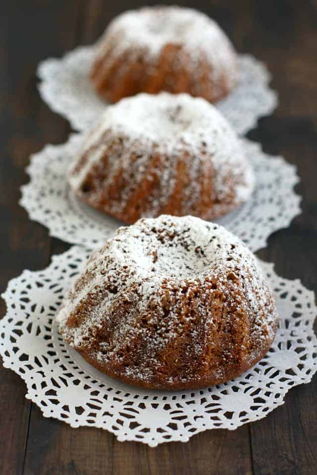 gingerbread mini bundt cakes on white doilies