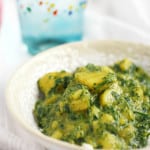 This creamy potato and spinach curry is surrounded with a silky coconut milk curry sauce that is full of spice and flavor!