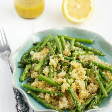 Healthy and delicious asparagus with quinoa is drizzled with lemon mustard vinaigrette. #vegan #asparagus