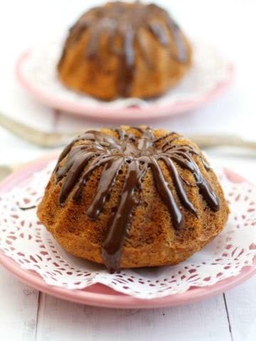 These cute banana coconut mini bundt cakes are covered with a tasty chocolate glaze! These are perfect for a special occasion! #vegan #glutenfree