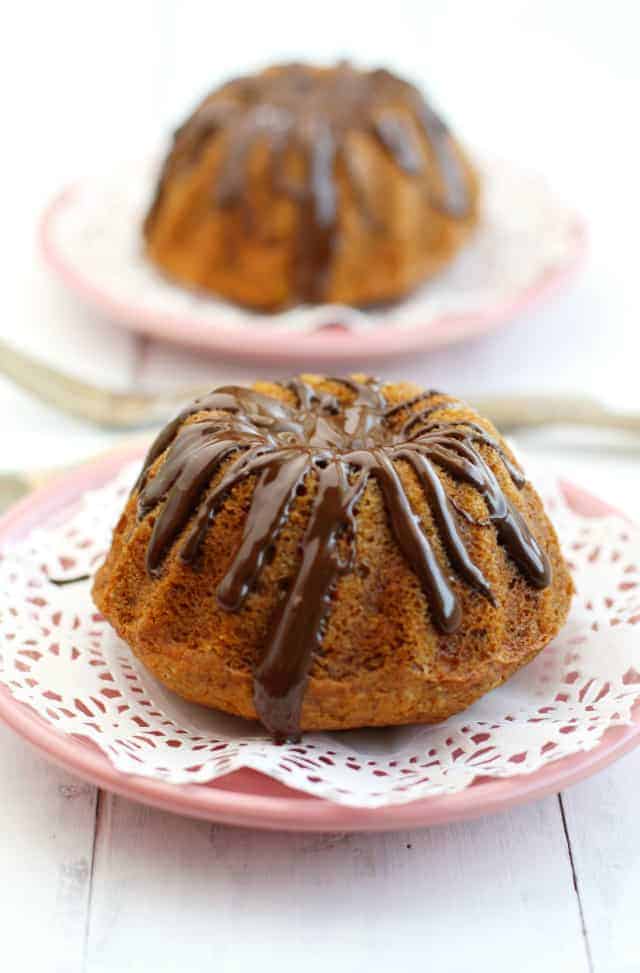 These cute banana coconut mini bundt cakes are covered with a tasty chocolate glaze! These are perfect for a special occasion! #vegan #glutenfree