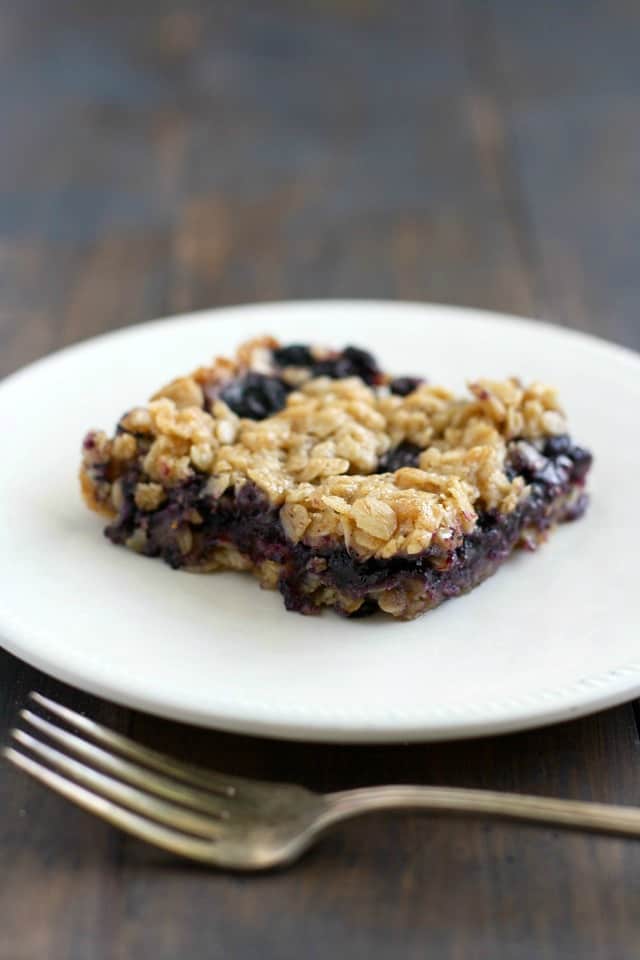 vegan blueberry crumble bar on a white plate