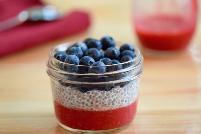 red white and blue chia parfait in a small jar