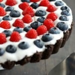 Red, white, and blue tart with a cremy filling and an Oreo cookie crust. No bake recipe. #patriotic