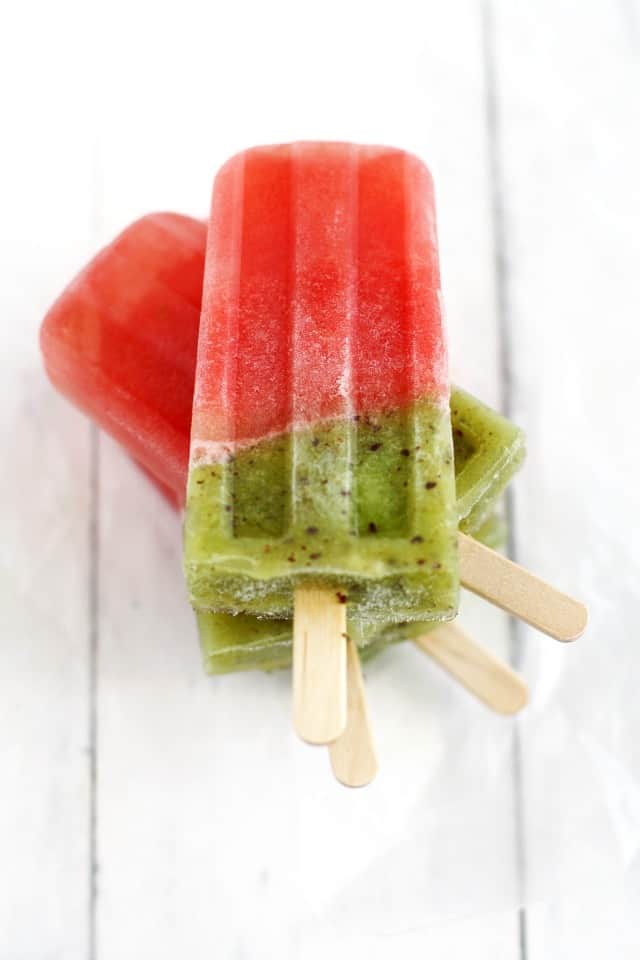 popsicles made with watermelon and kiwi on a white background