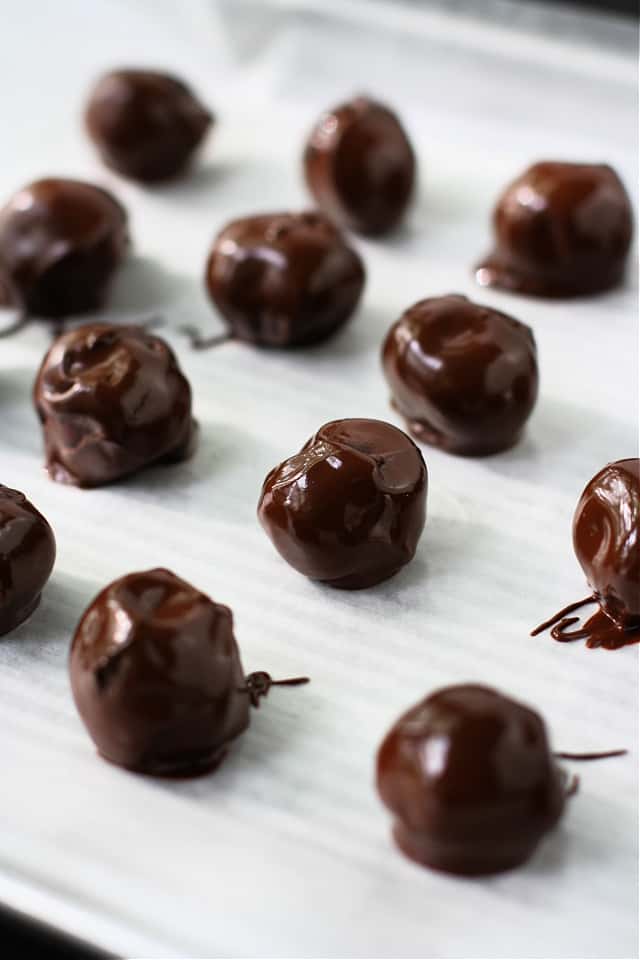 chocolate covered cherries on a tray