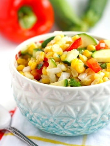 picnic corn salad in a white and blue bowl