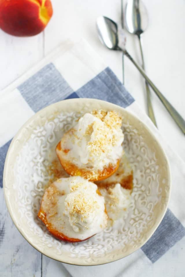 Roasted peaches with toasted coconut and vanilla ice cream makes a simple and elegant summer dessert!