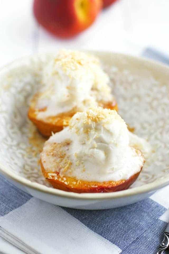 Simple dessert for summer! Roasted peaches with toasted coconut and ice cream. 