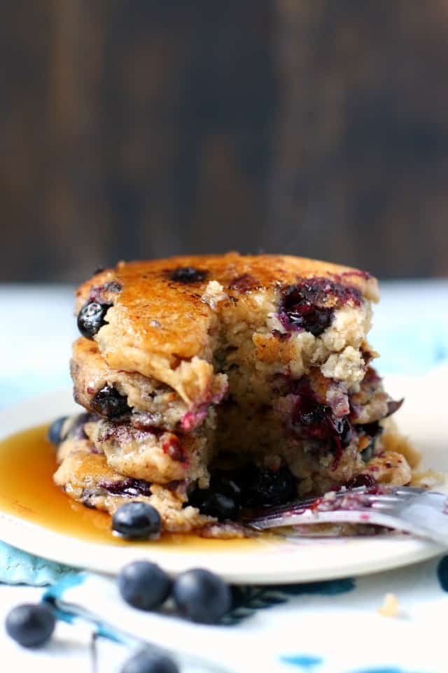 vegan blueberry pancakes on a plate with a fork