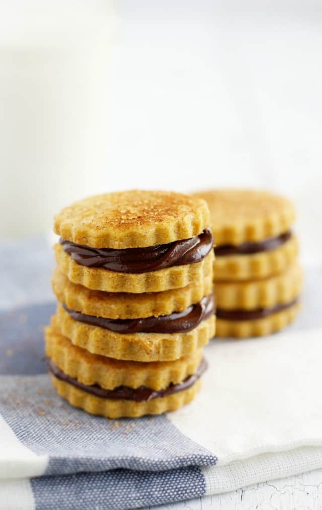 stack of pumpkin spice sugar cookies with chocolate filling