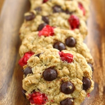 Chewy and delicious chocolate chip oatmeal cookies are made extra festive with the addition of fresh cranberries! Vegan and gluten free recipe.
