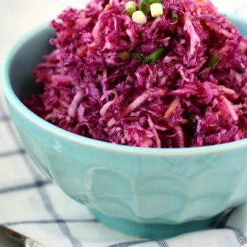 Simple red cabbage slaw with apples is sweet and tangy, and a terrific side dish!