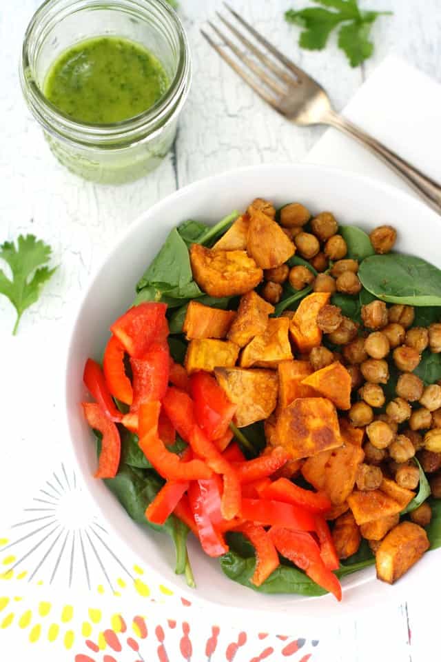 A healthy fall salad with roasted sweet potatoes, chickpeas, and cilantro vinaigrette. Vegan and gluten free. 
