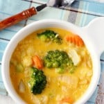 A hearty and comforting cheesy vegetable rice soup that's sure to be a hit with your family! Gluten free.