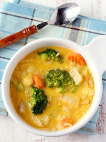A hearty and comforting cheesy vegetable rice soup that's sure to be a hit with your family! Gluten free.