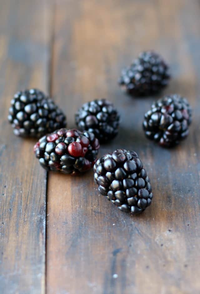 fresh blackberries on a wooden background