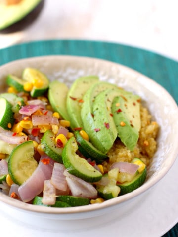 A colorful and flavorful lunch bowl with quinoa, veggies, and avocado. Gluten free and vegan recipe.