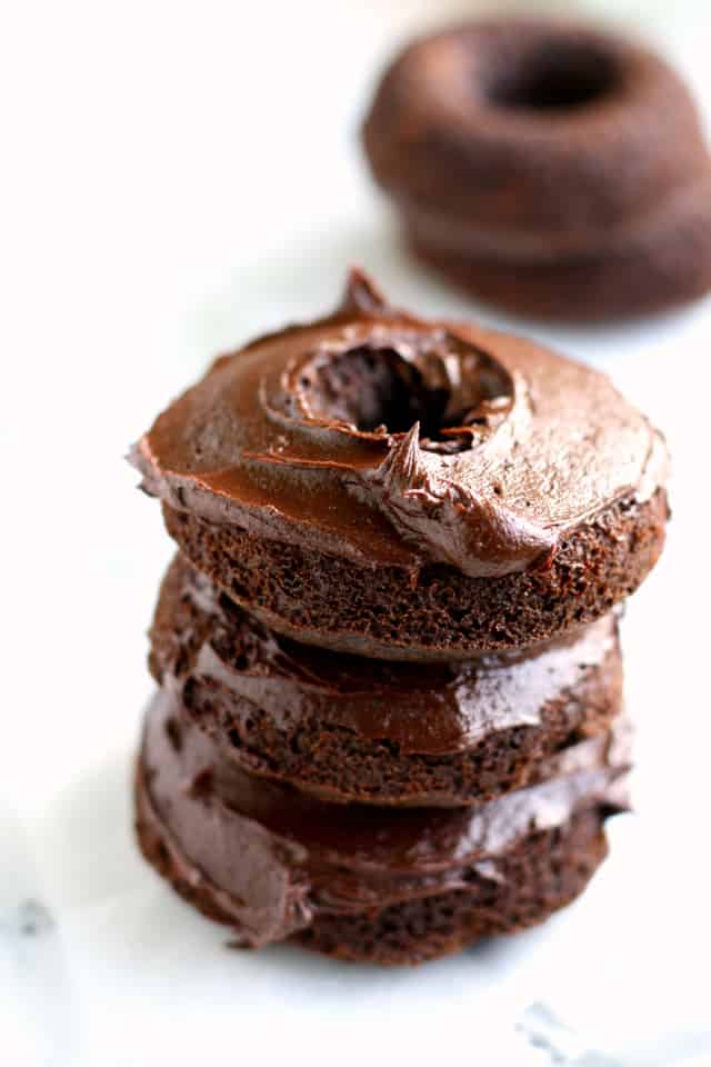 stack of frosted chocolate donuts