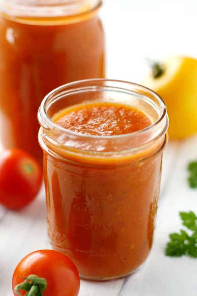Slow cooker tomato sauce is easy to make, and a great way to use up all those garden tomatoes!